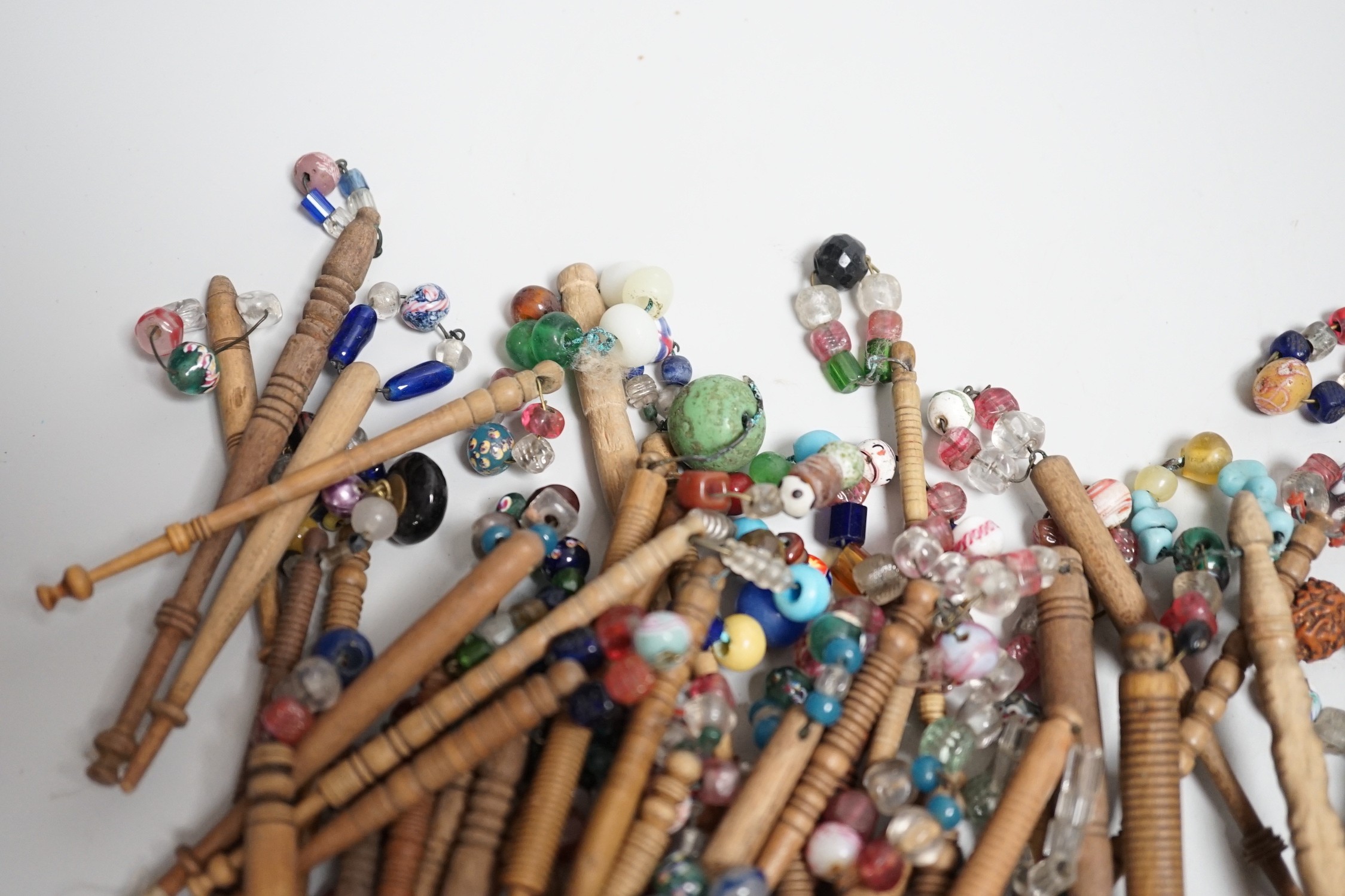 Fifty 19th century finely turned wooden lace bobbins with beaded ends together with 35 ornate wooden bobbins with beaded ends and 5 plain wooden bobbins unleaded (90)